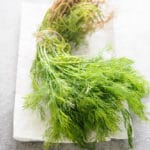 A bunch of dill on a paper towel