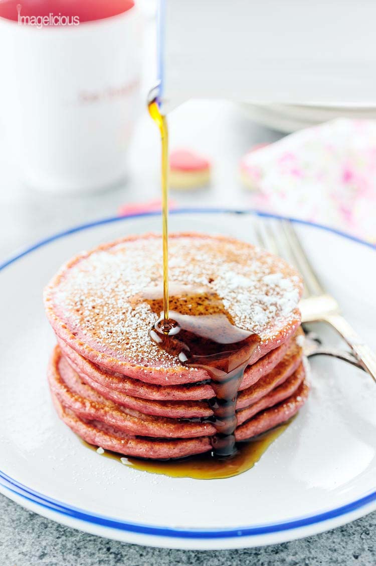 These beautiful pink Cinnamon Beet Pancakes are full of healthy beets and greek yogurt, yet you'll never know as they taste delicious. Perfect for a Valentine's Day breakfast or to make any breakfast special | Imagelicious