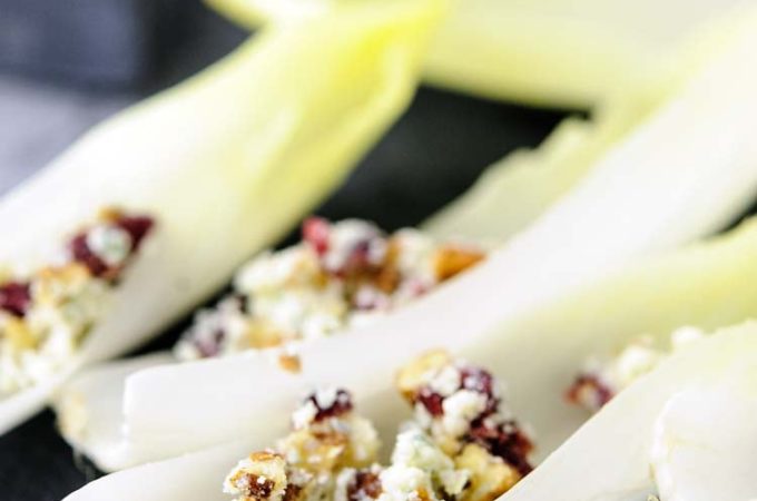 Easy and quick endive with blue cheese, pecans, and cranberries is a delicious and elegant appetizer for a weeknight dinner or a big party. It takes only minutes to make and can be prepared in advance. Healthy and full of complex flavour | Imagelicious