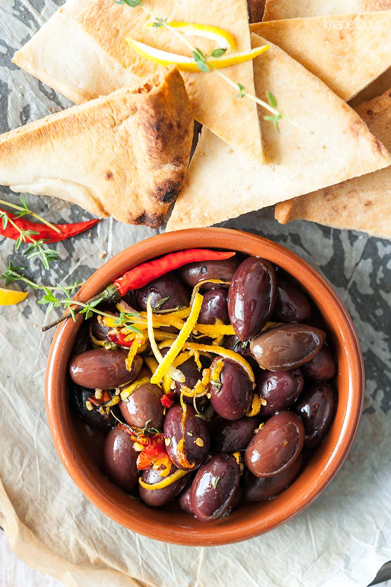 Lemon Baked Olives are wonderfully spicy and earthy with bright lemon, thyme and chili flavours | Imagelicious