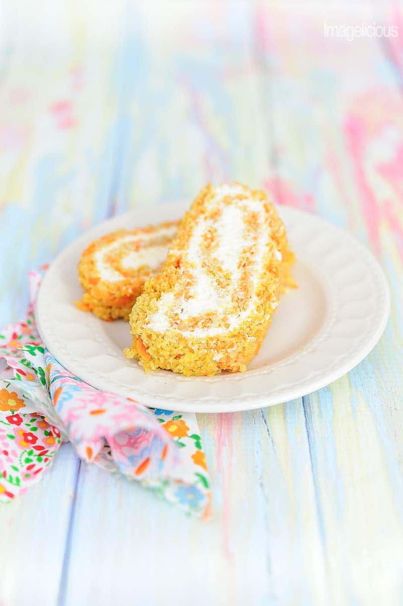 This Carrot Cake Roll with Light Cream Cheese Filling is a perfect spring dessert. The cake has no oil or butter and is lighter and healthier than traditional Carrot Cakes | Imagelicious