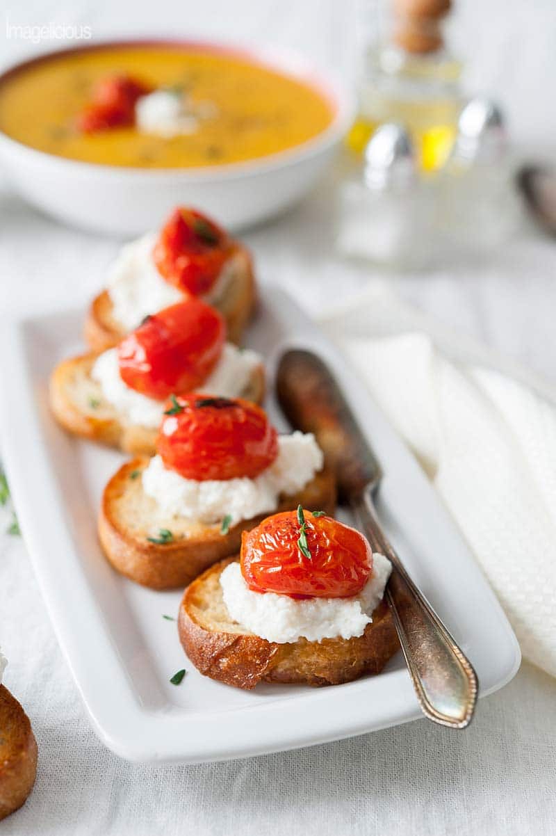 Tomato-Ricotta Bruschetta - crusty baguette topped with creamy ricotta and tangy tomatoes | Imagelicious
