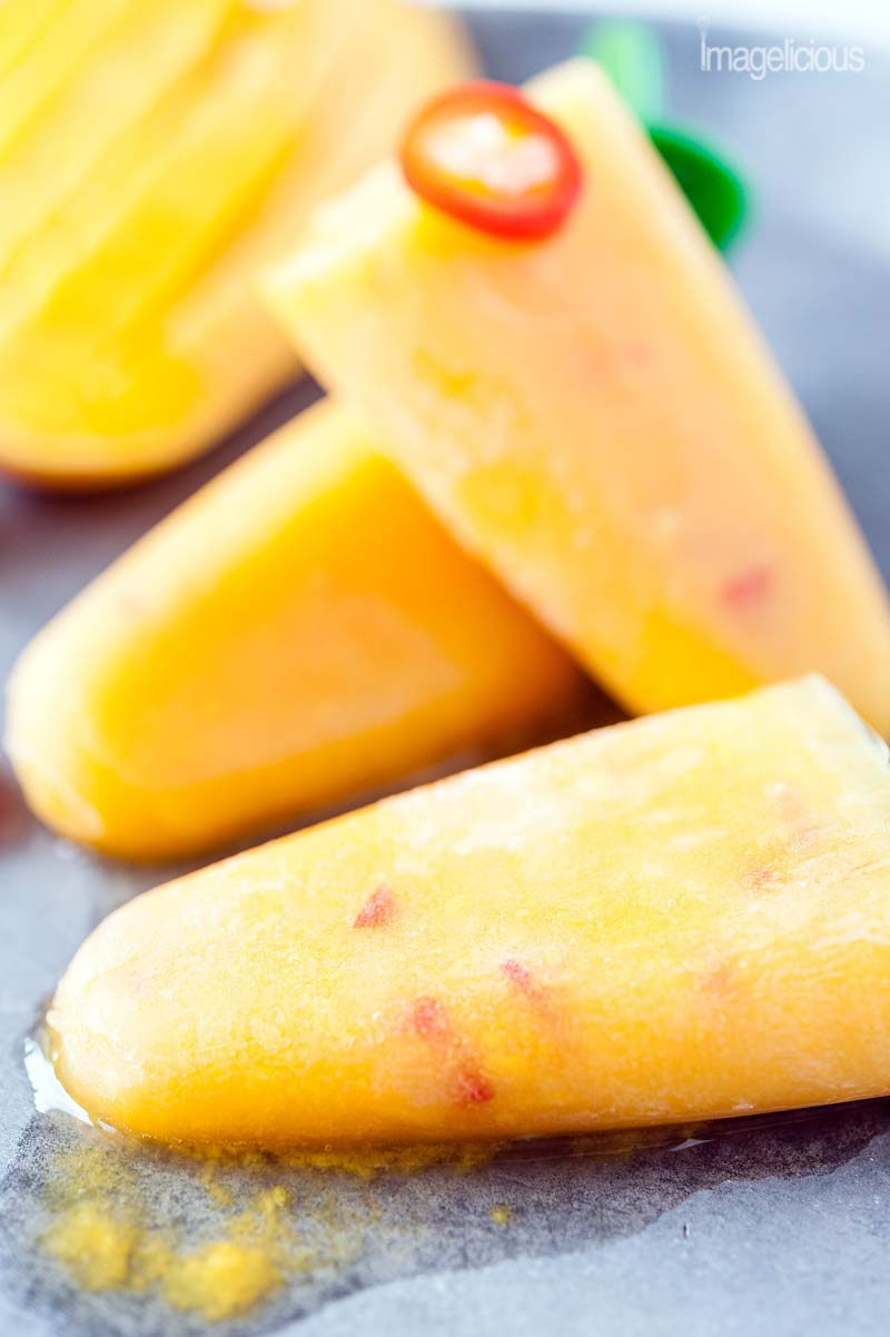 Close up view of Mango Orange Chili Popsicles