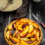 Peach-Plum Almond Tart is deliciously crumbly and nutty, perfect accompaniment to peaches and plums. Great to enjoy during summer with some cold whipped cream | Imagelicious