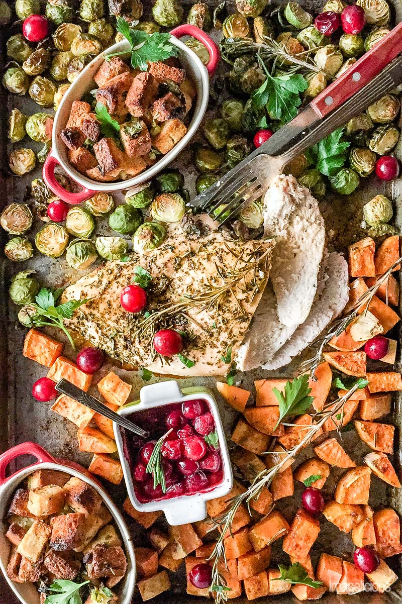 Sheet pan with cooked thanksgiving dinner.