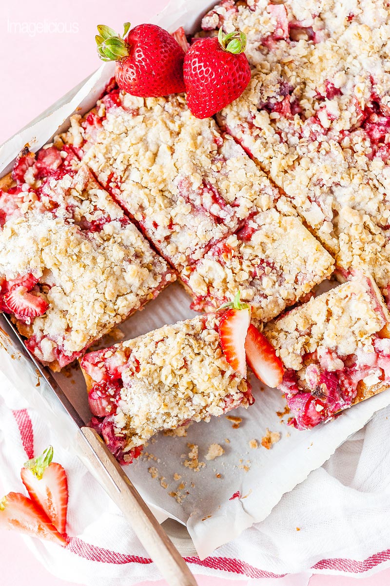 Top down view of a tray with Strawberry Rhubarb Bars