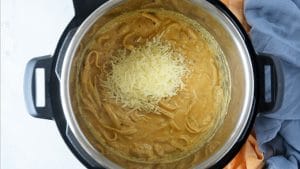 Process shot: parmesan added to pasta in Instant Pot