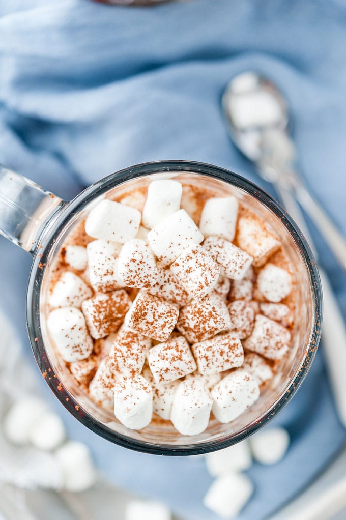 Closeup of a top down view of a mug of Instant Pot Hot Chocolate with focus on the marshmallows on top of the drink