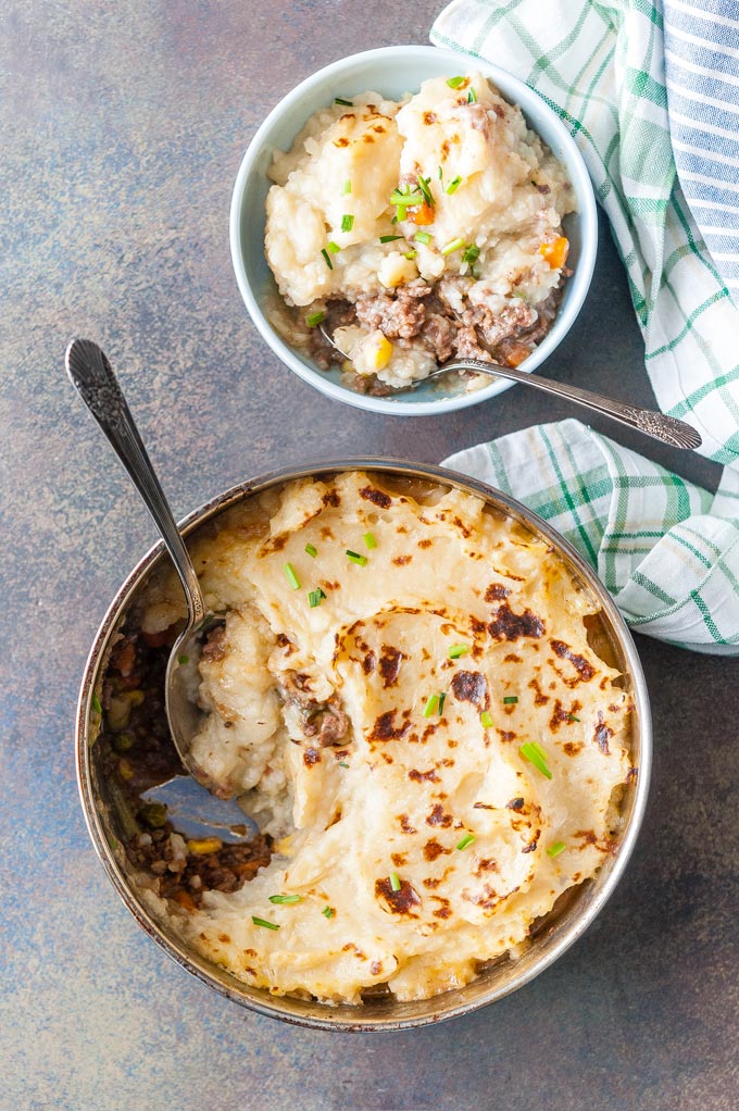 Another top down view of a pan with Instant Pot Shepherd's Pie and a bowl with more pie