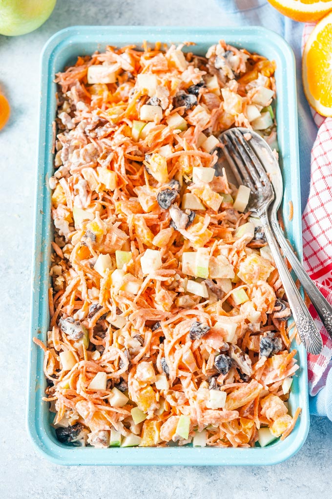 Big tray with fully mixed and dressed Creamy Carrot Fruit Salad
