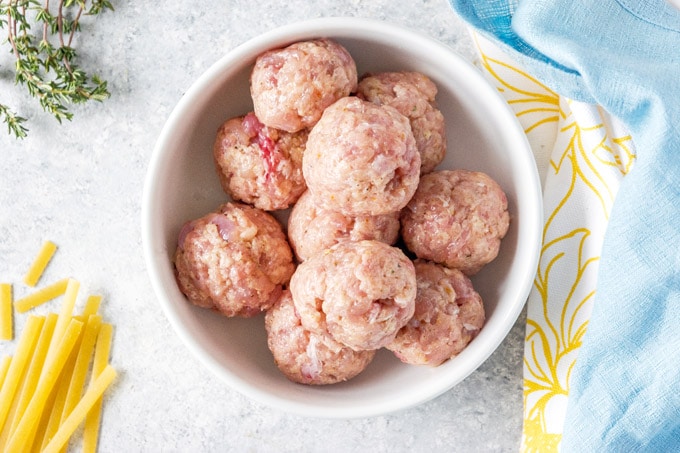 Raw chicken meatballs in a bowl