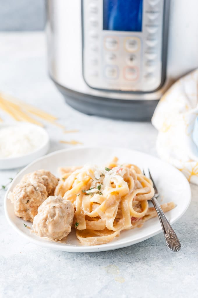Plate with Instant Pot Creamy Pasta and Meatballs