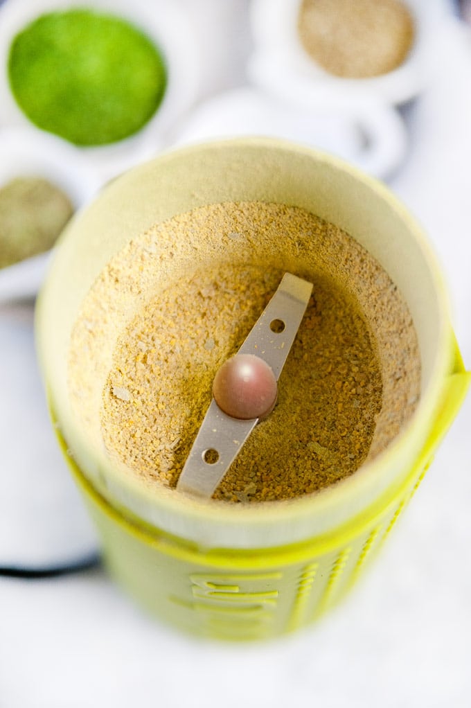 Powdered fenugreek in a coffee grinder