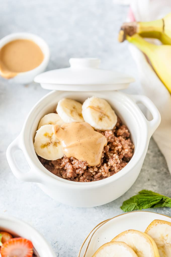 Close up of a chocolate quinoa with bananas and peanut butter.