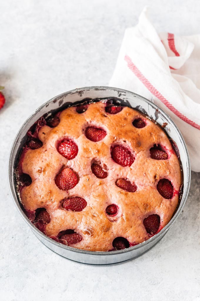 Baked strawberry cake in a pan.
