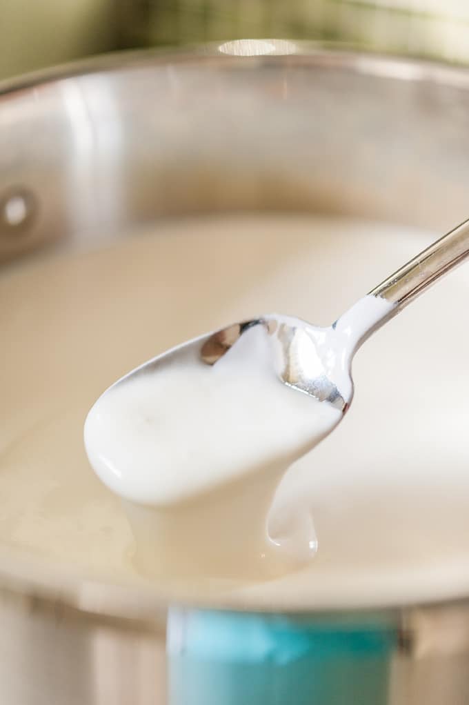 Spoon in a mixture of milk and buttermilk.
