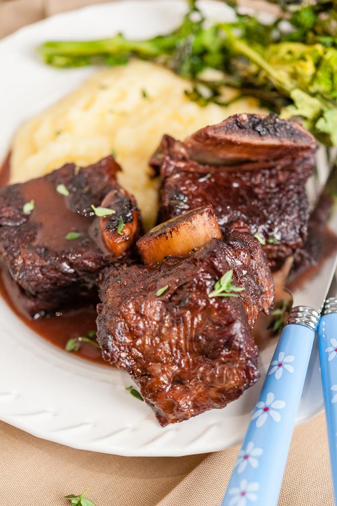 Plate with Cranberry Braised Beef Short Ribs.