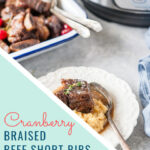 These Cranberry Braised Beef Short Ribs are rich savoury, succulent and delicious. They can be made in the oven or Instant Pot. Perfect for a special holiday meal | imagelicious.com #instantpotribs #braisedbeefshortribs #braisedribs #instantpotrecipes