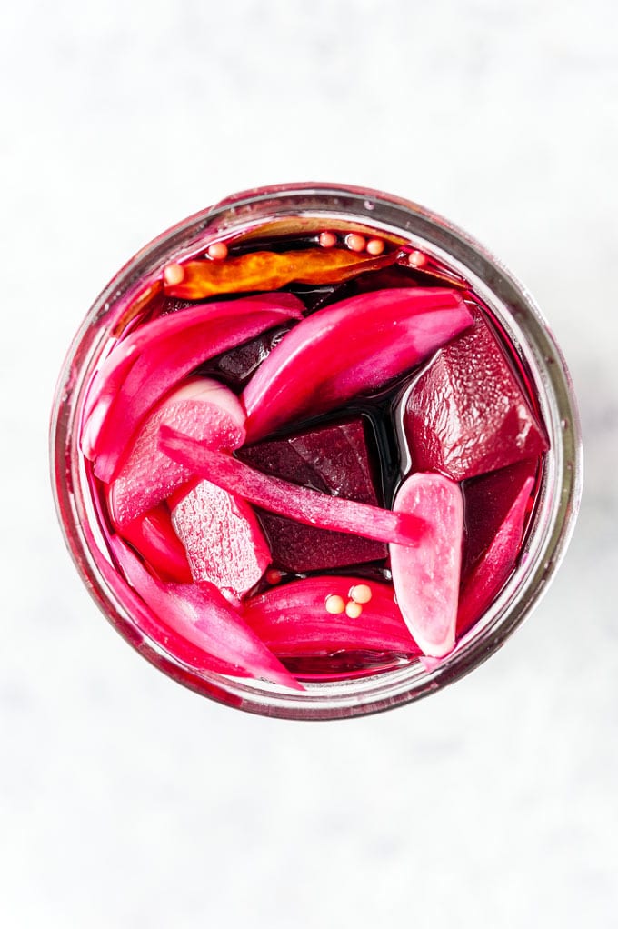 Top down view of a jar with Pickled Beets.