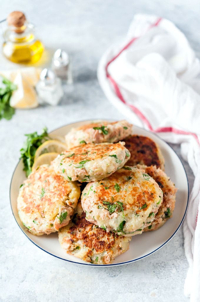 Pile of potato fish cakes on a plate.
