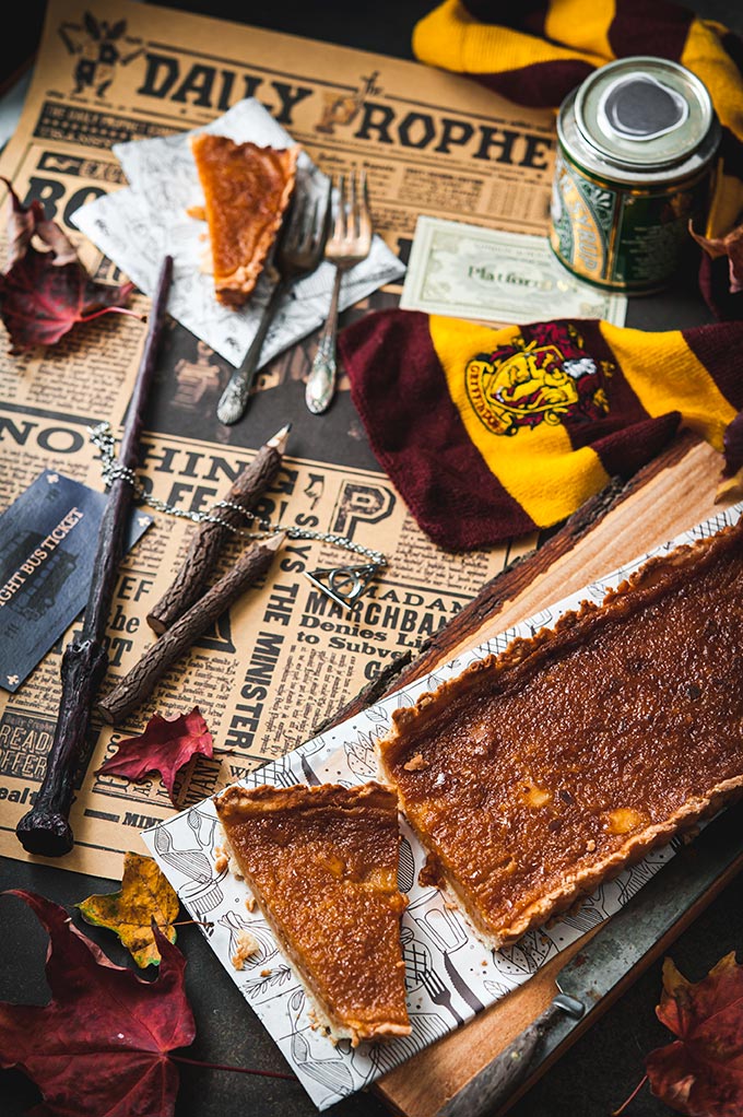 Treacle Tart and Harry Potter props around it.